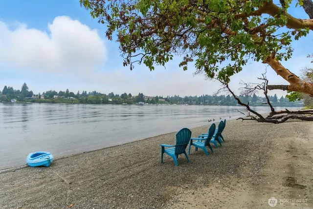 a view of a lake with outdoor seating
