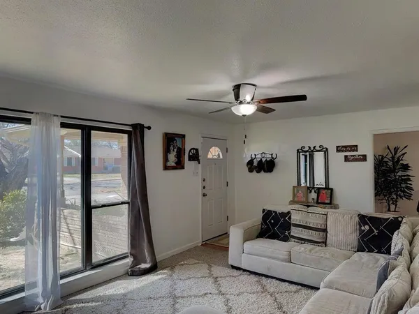 a living room with furniture and a window