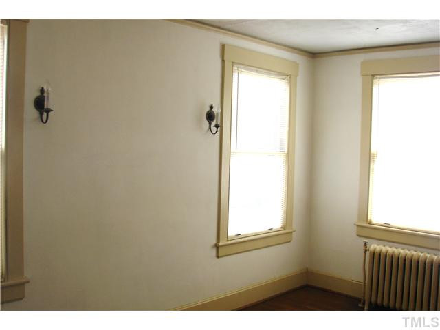303 Hillcrest Road Raleigh, NC 27605 - Photo 14 of 21 a view of a bathroom that has a window in it