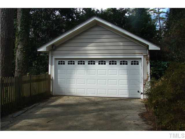 303 Hillcrest Road Raleigh, NC 27605 - Photo 17 of 21 a front view of a house with a yard