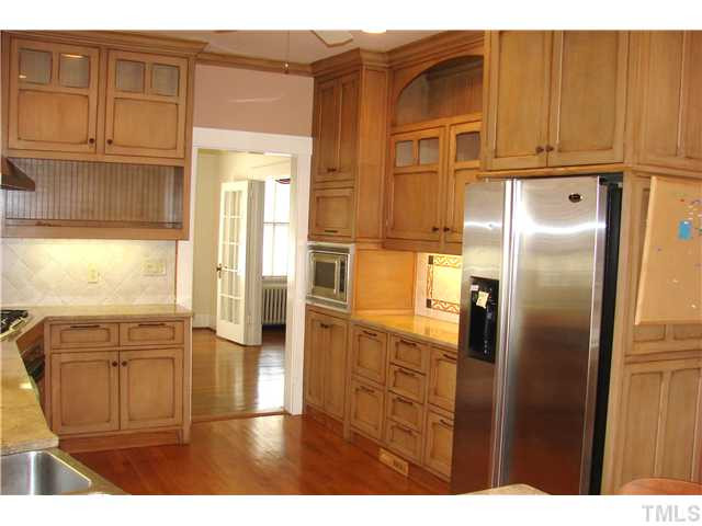 303 Hillcrest Road Raleigh, NC 27605 - Photo 4 of 21 a kitchen with stainless steel appliances granite countertop a refrigerator and a sink