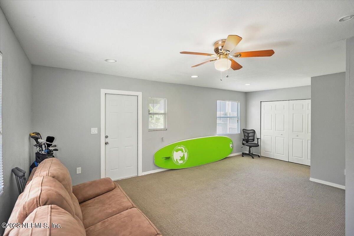 197 Lynn Street St. Augustine, FL 32084 - Photo 17 of 24 a living room with furniture and a ceiling fan