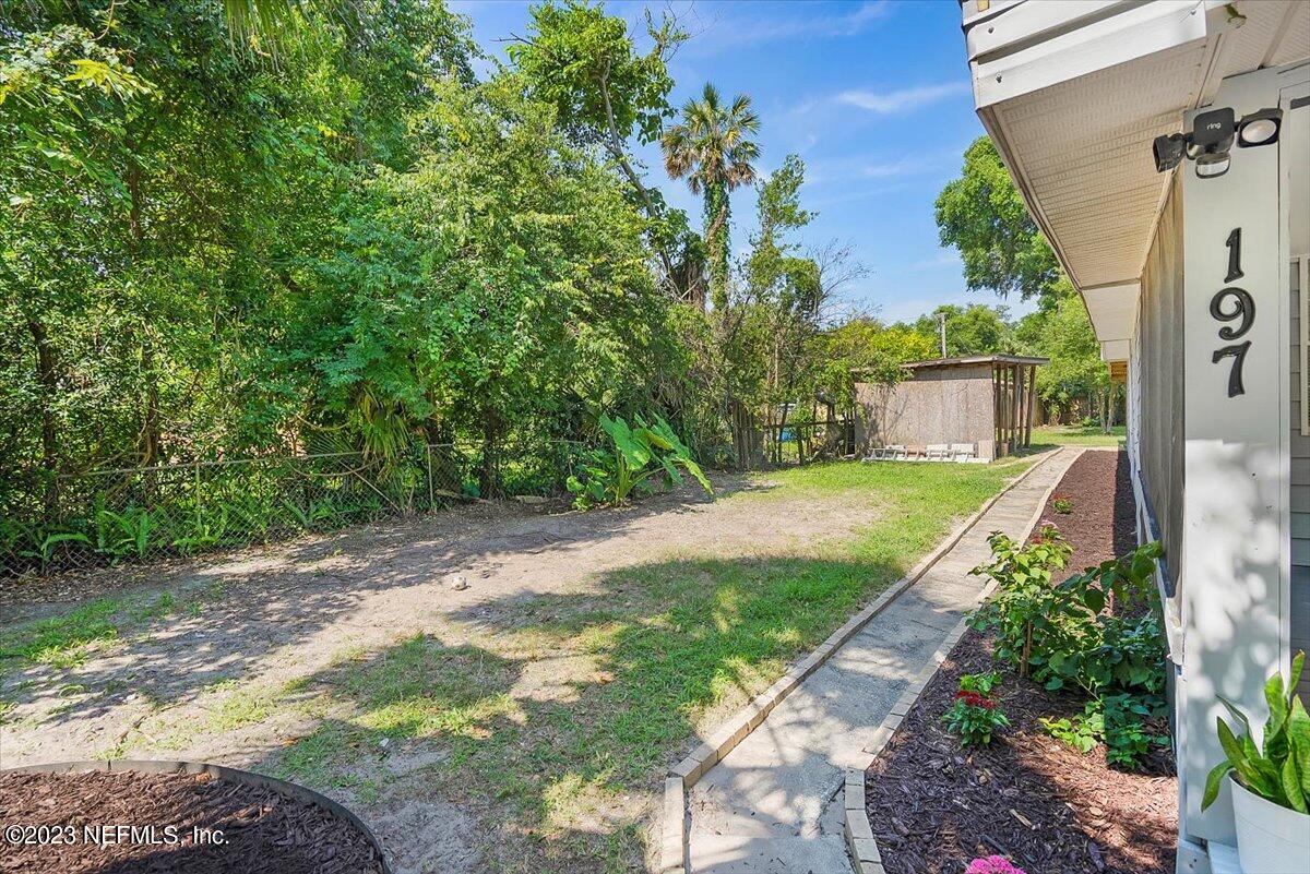 197 Lynn Street St. Augustine, FL 32084 - Photo 20 of 24 a view of a backyard with potted plants