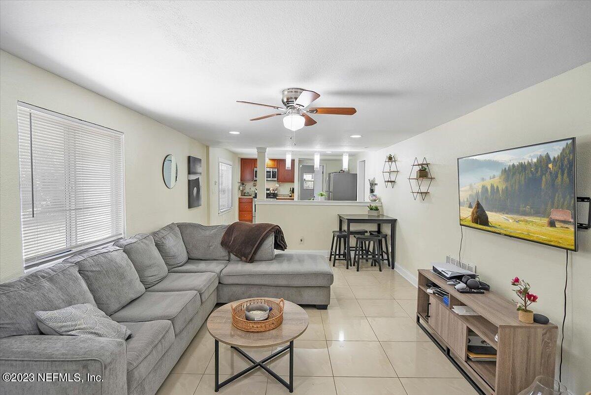 197 Lynn Street St. Augustine, FL 32084 - Photo 7 of 24 a living room with furniture and a flat screen tv