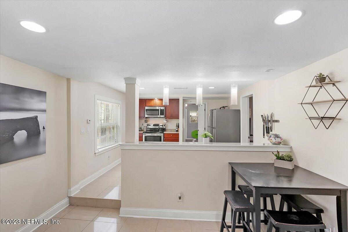 197 Lynn Street St. Augustine, FL 32084 - Photo 8 of 24 a view of a dining room with furniture and window