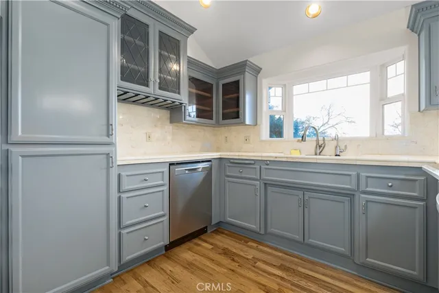 a kitchen with a sink and cabinets