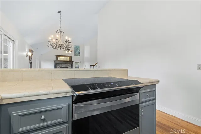 a view of a dining room with furniture and chandelier