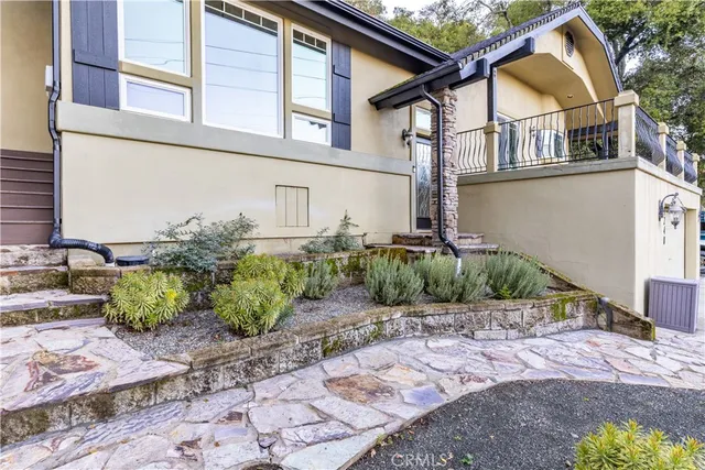 a front view of a house with garden