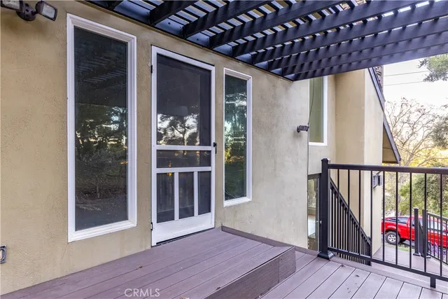 a view of entryway with wooden floor