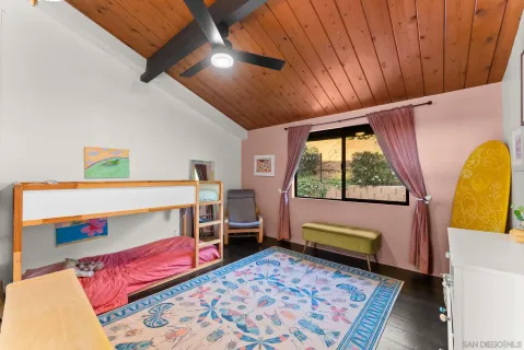 a bedroom with furniture and a window