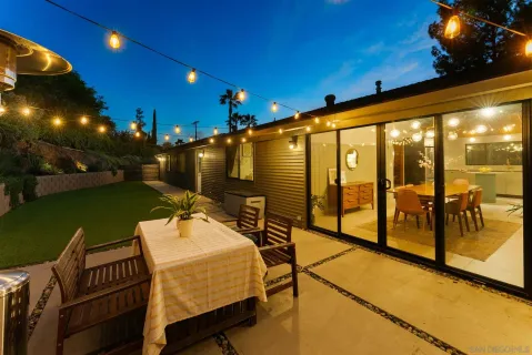 a view of a patio with a yard