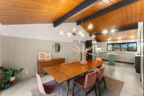 a dining room with a table and chairs