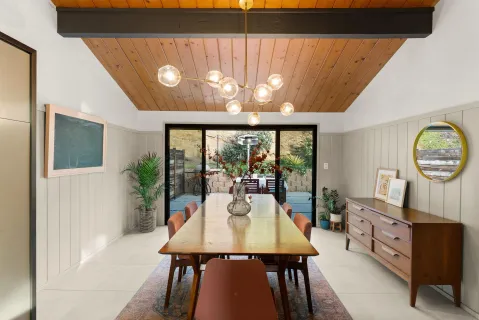 a view of a dining room with furniture window and outside view