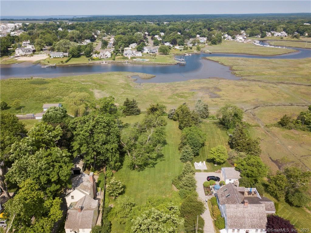Never before offered for sale this pristine park like setting, 1.71 acres! Beautiful views, walk to town, local marina and beach just a minute walk away!