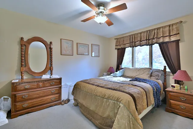 a bedroom with a bed and a dresser