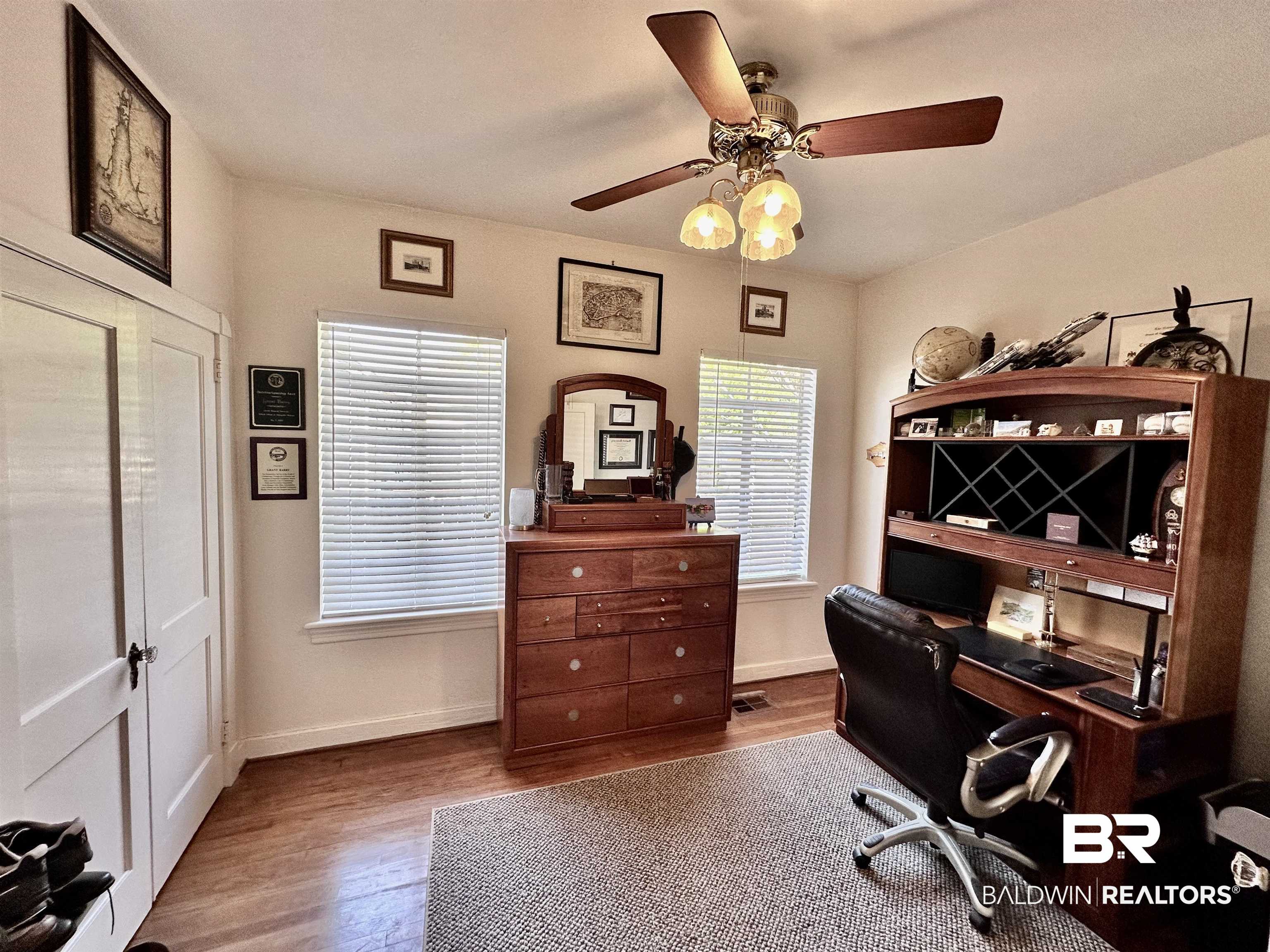 260 Siena Vista Street Mobile, AL 36607 - Photo 12 of 41 Home office with wood finished floors, a ceiling fan, and baseboards