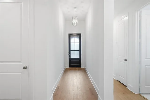 a large kitchen with a large counter top stainless steel appliances and cabinets