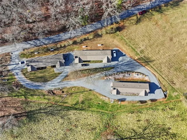 a view of a house with backyard space and lake view