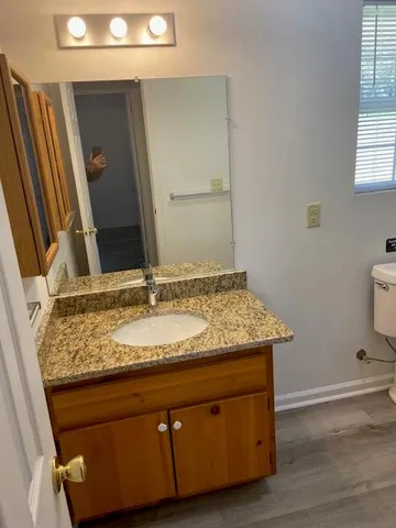 a view of hallway with wooden floor