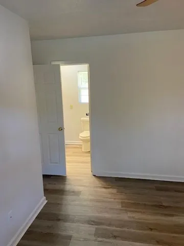 a bedroom with bed and a window