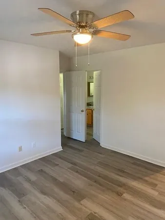 a spacious bathroom with a double vanity sink and a mirror