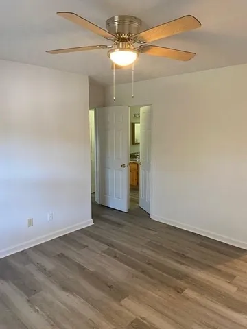 a spacious bathroom with a double vanity sink and a mirror