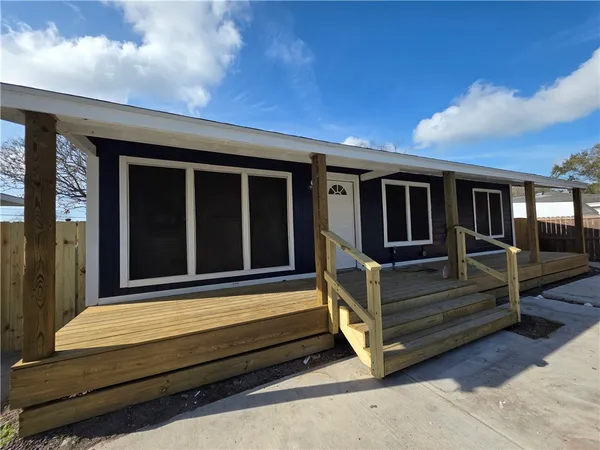a view of sitting area in front of house
