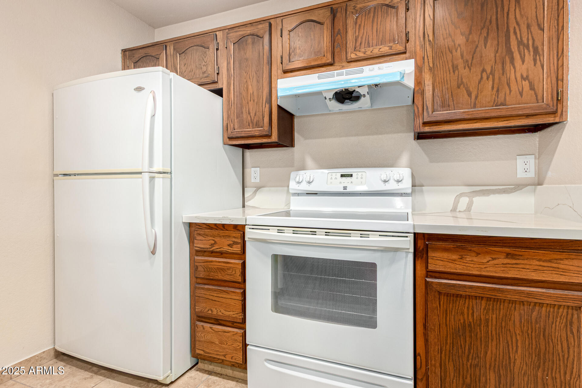 510 North Alma School Road, Unit 159 Mesa, AZ 85201 - Photo 12 of 36 a white refrigerator freezer sitting inside of a kitchen