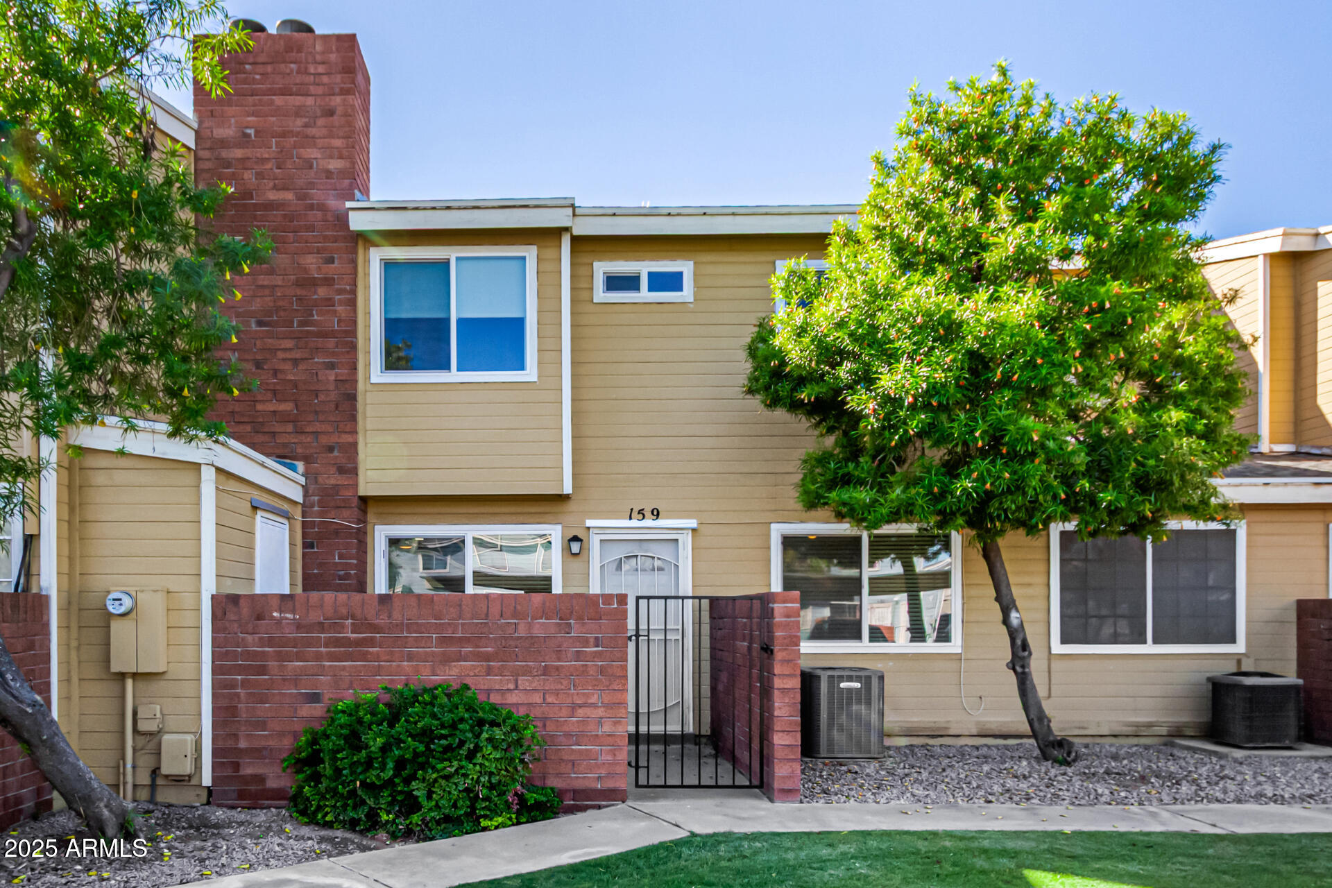 510 North Alma School Road, Unit 159 Mesa, AZ 85201 - Photo 2 of 36 a front view of a house with garden