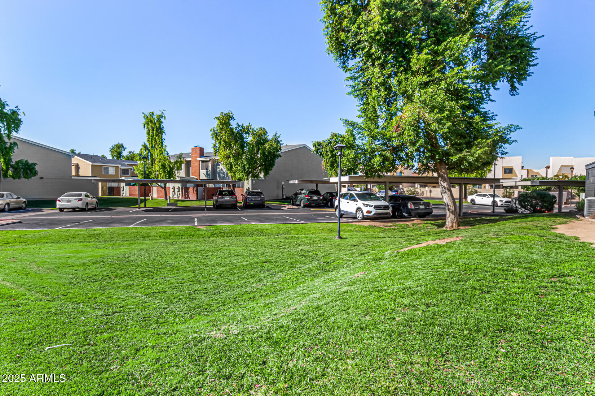 510 North Alma School Road, Unit 159 Mesa, AZ 85201 - Photo 30 of 36 a view of a house with a back yard