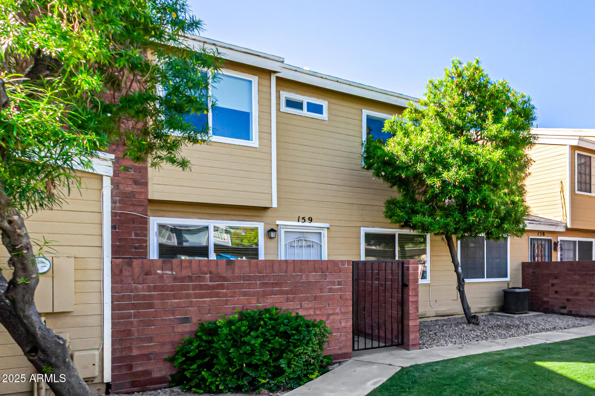 510 North Alma School Road, Unit 159 Mesa, AZ 85201 - Photo 4 of 36 front view of a house with a yard