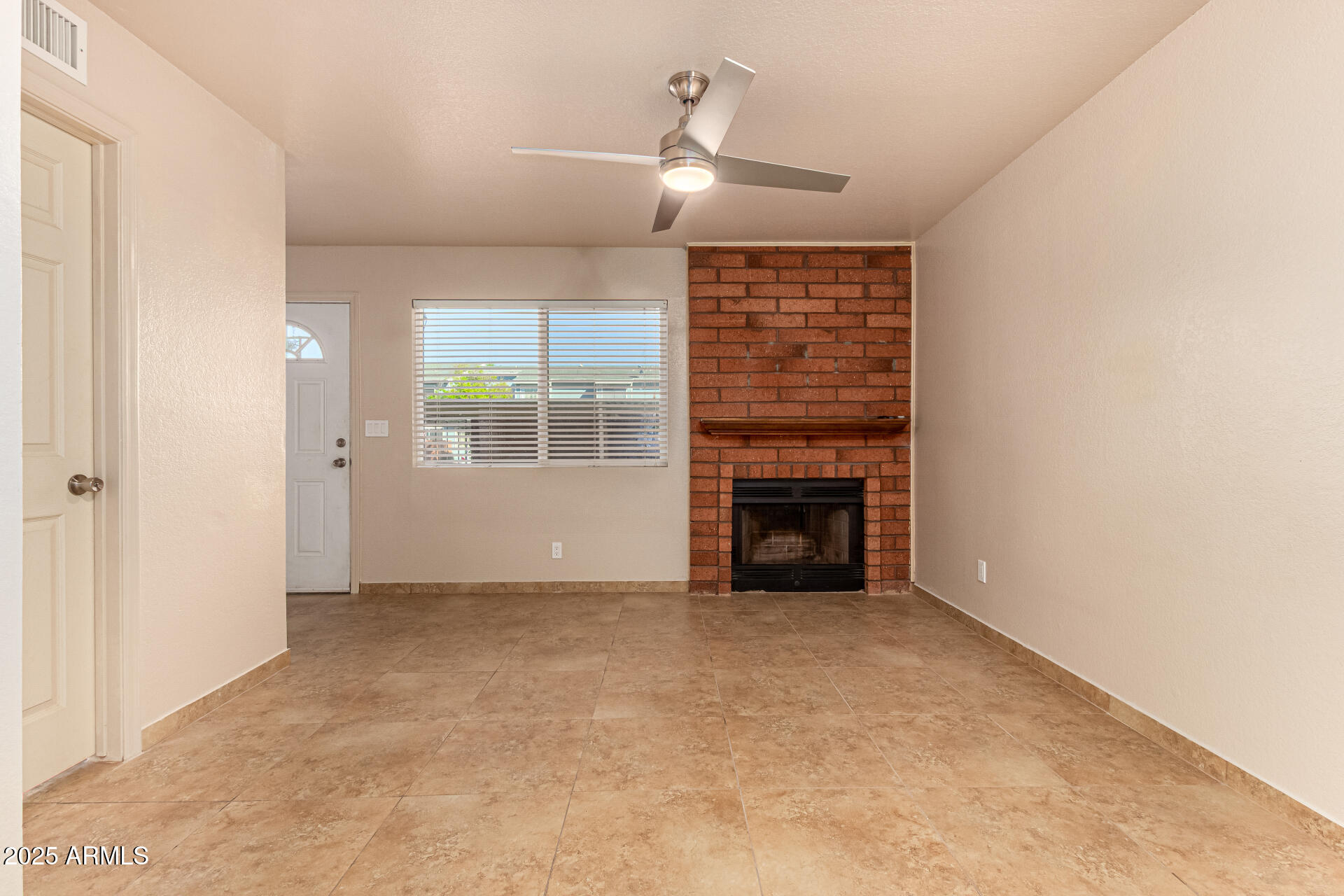 510 North Alma School Road, Unit 159 Mesa, AZ 85201 - Photo 8 of 36 an empty room with windows and fireplace