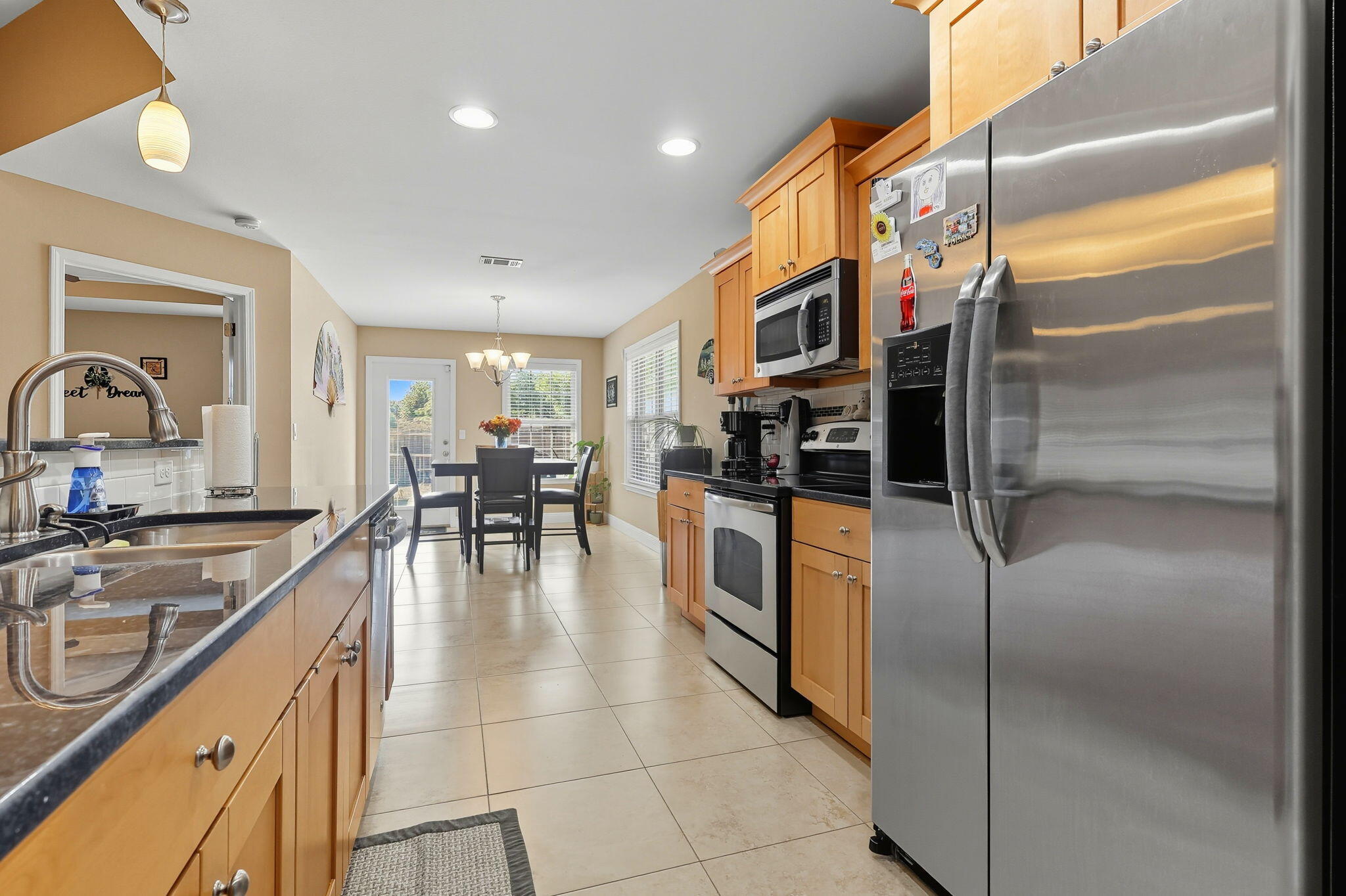 219 January Court Crestview, FL 32539 - Photo 12 of 37 a kitchen with stainless steel appliances granite countertop a refrigerator and a sink