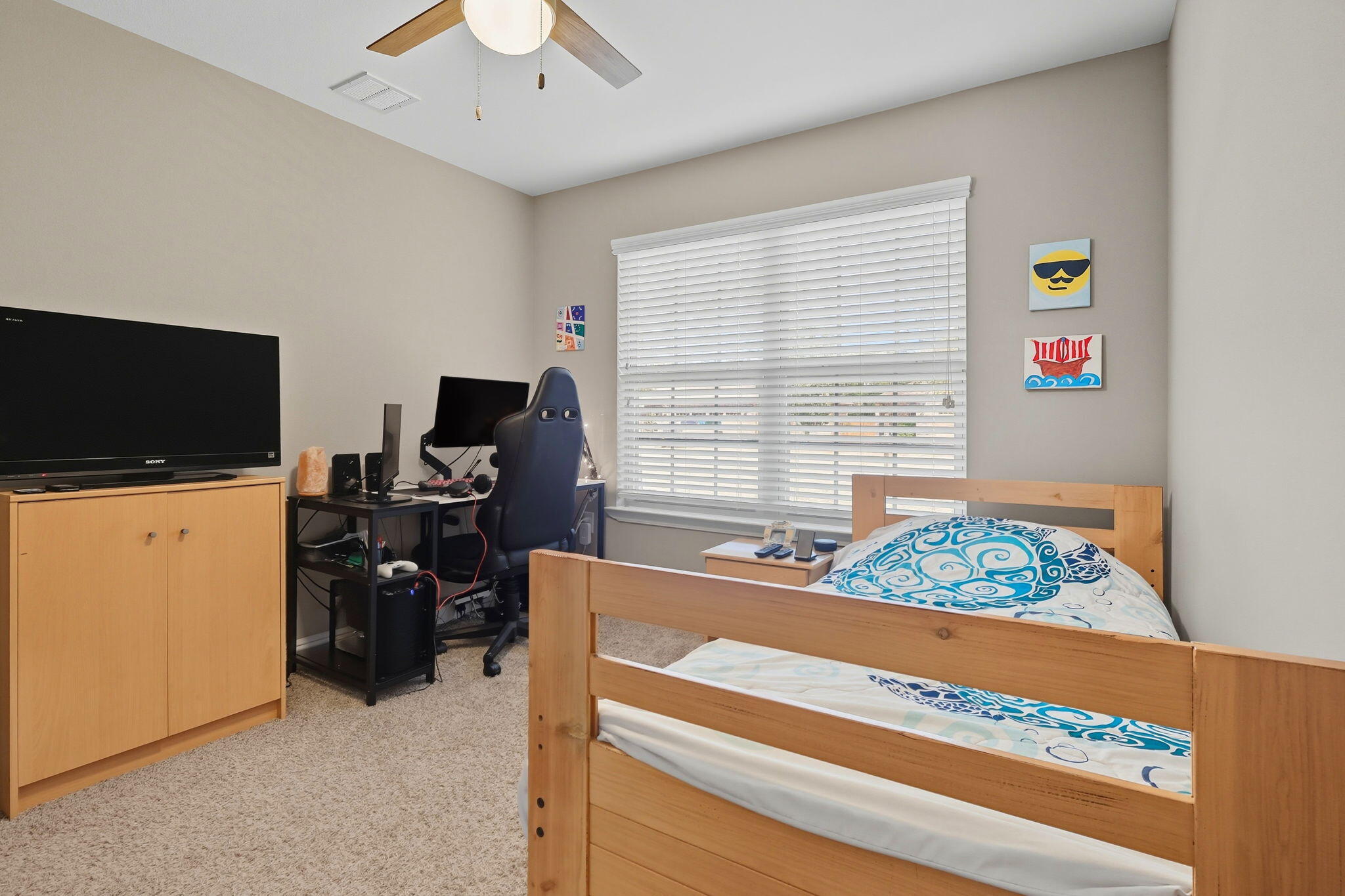 219 January Court Crestview, FL 32539 - Photo 23 of 37 a bedroom with a bed and a flat screen tv