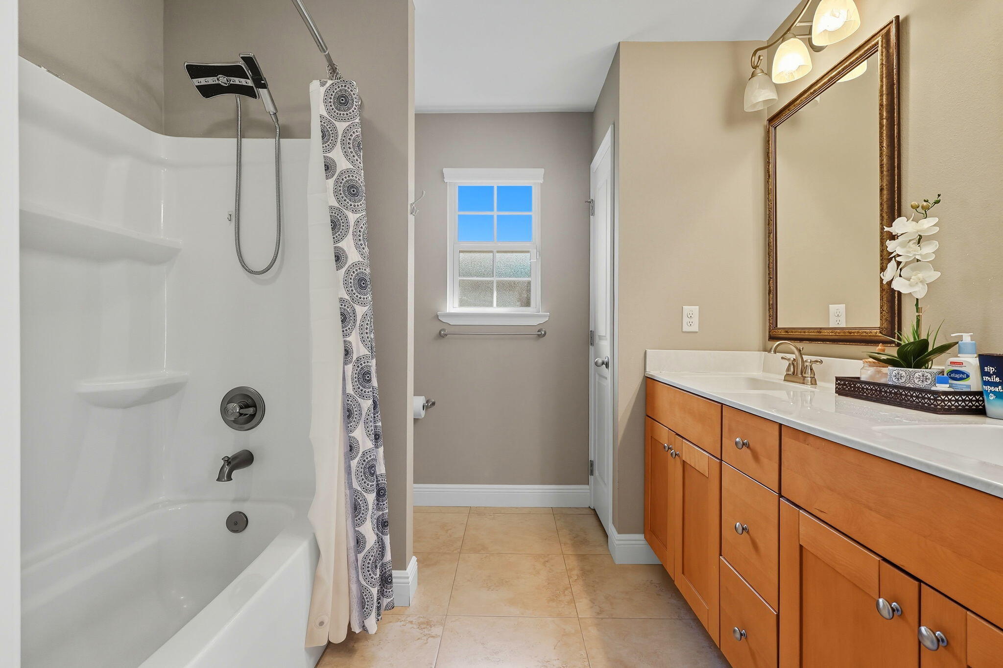 219 January Court Crestview, FL 32539 - Photo 26 of 37 a bathroom with a granite countertop sink a mirror a bathtub and shower