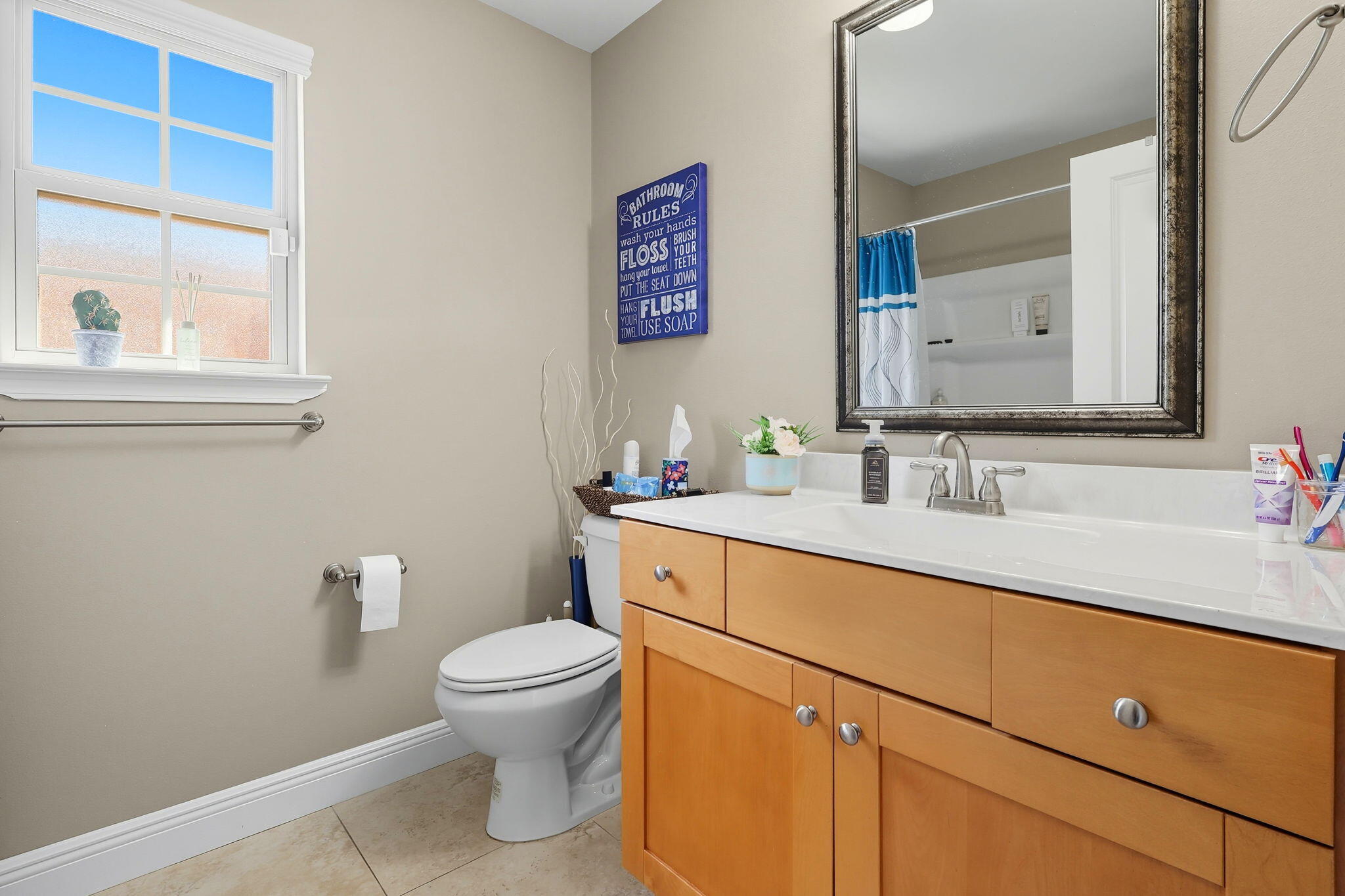 219 January Court Crestview, FL 32539 - Photo 29 of 37 a bathroom with a sink a toilet and a mirror