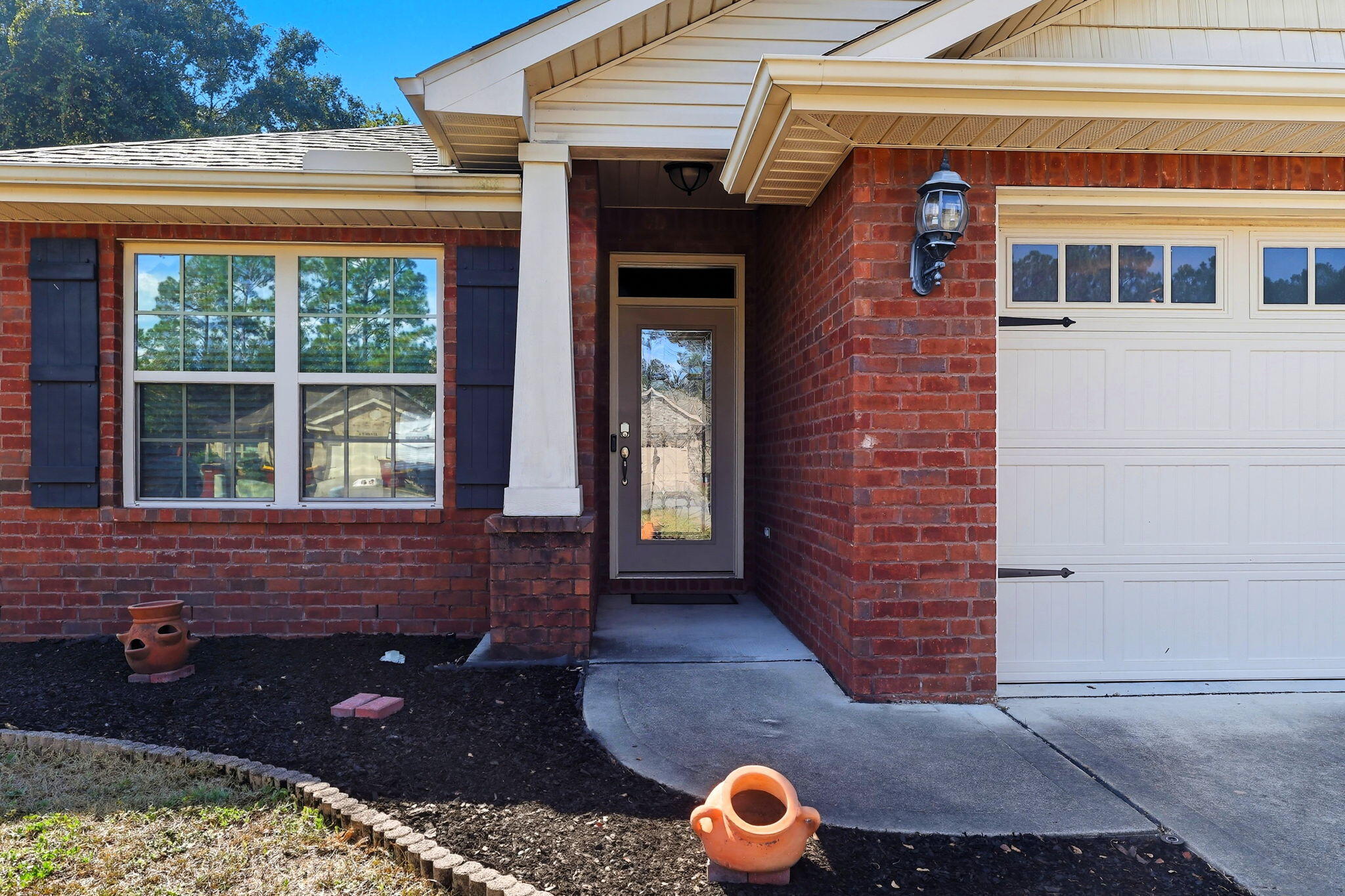 219 January Court Crestview, FL 32539 - Photo 5 of 37 a front view of a house with a yard