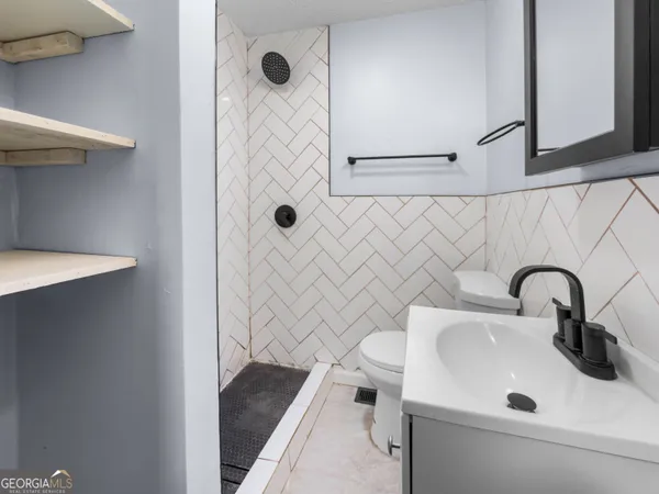 a bathroom with a sink and a toilet