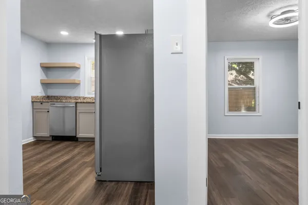 a view of a kitchen from the hallway