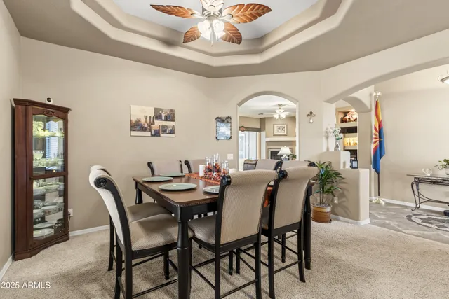 a kitchen with refrigerator and cabinets