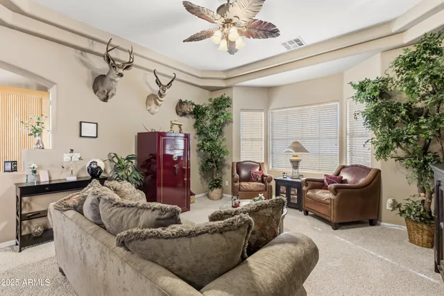 a kitchen with granite countertop a table chairs stove and cabinets