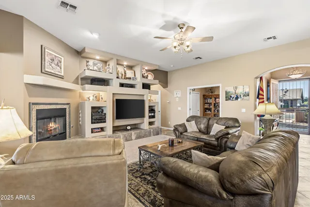 a bedroom with a bed dresser and a flat tv screen