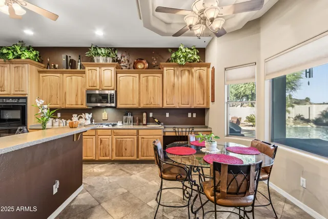 a bathroom with a tub double sink and mirror