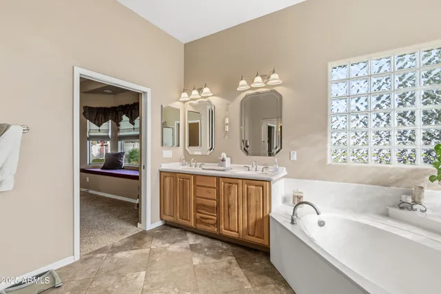 an aerial view of a house with a mountain