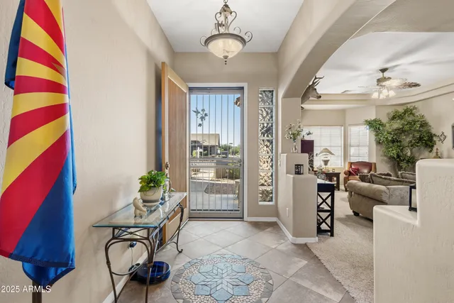 a living room with furniture and a large window