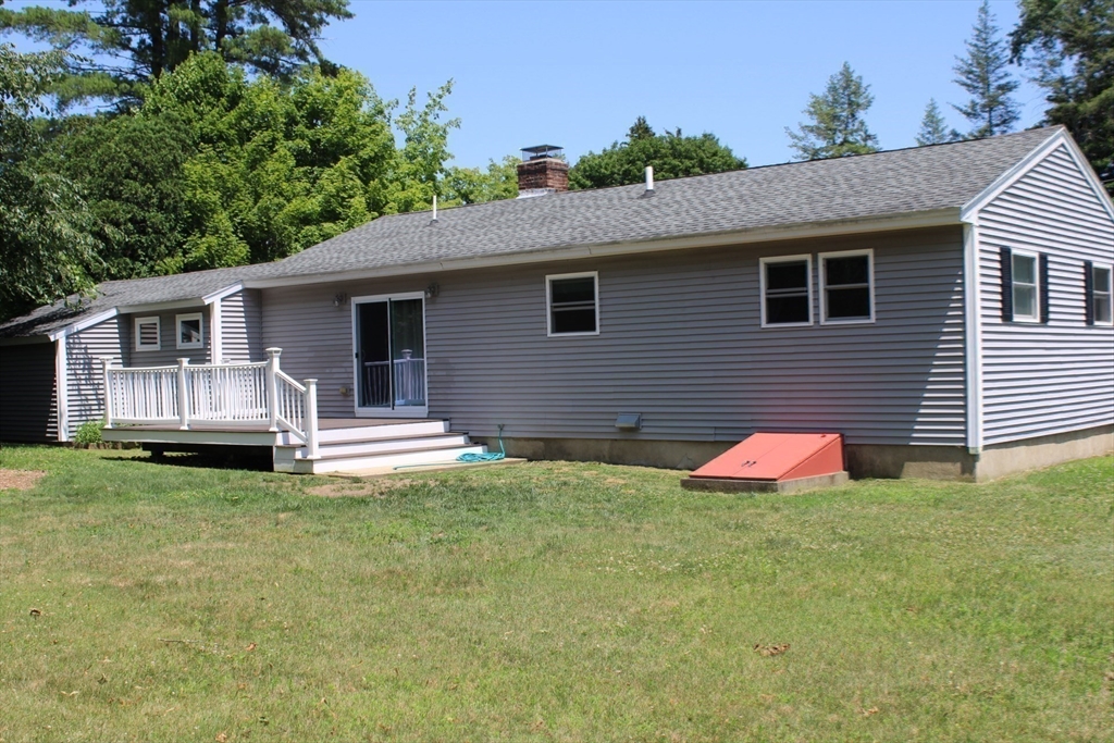 21 Whitcomb Drive Lancaster, MA 01523 - Photo 23 of 23 a view of a house with a yard and a garden