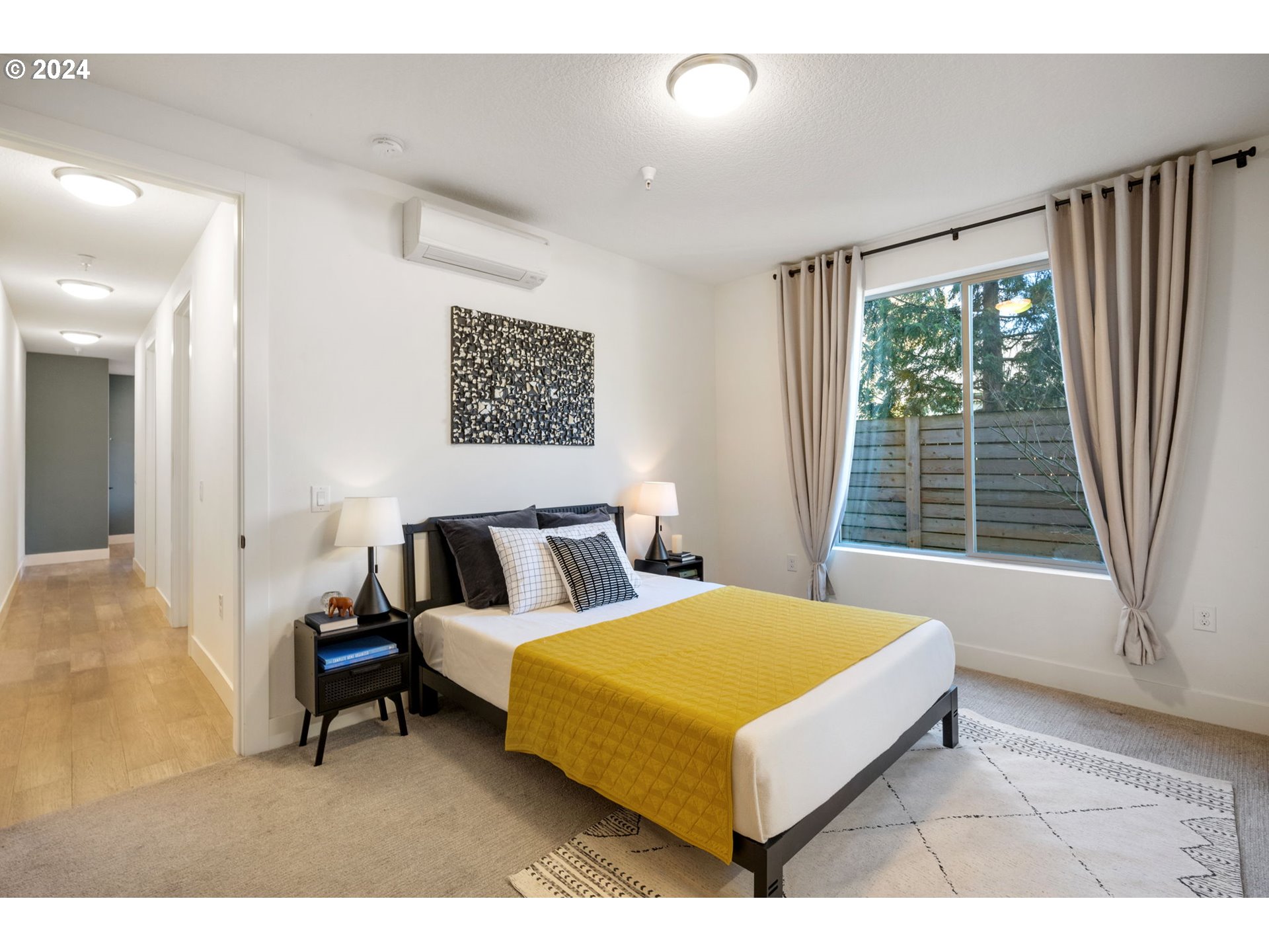 1616 Northeast 45th Avenue, Unit 1 Portland, OR 97213 - Photo 17 of 30 a bed room with a bed and a large window