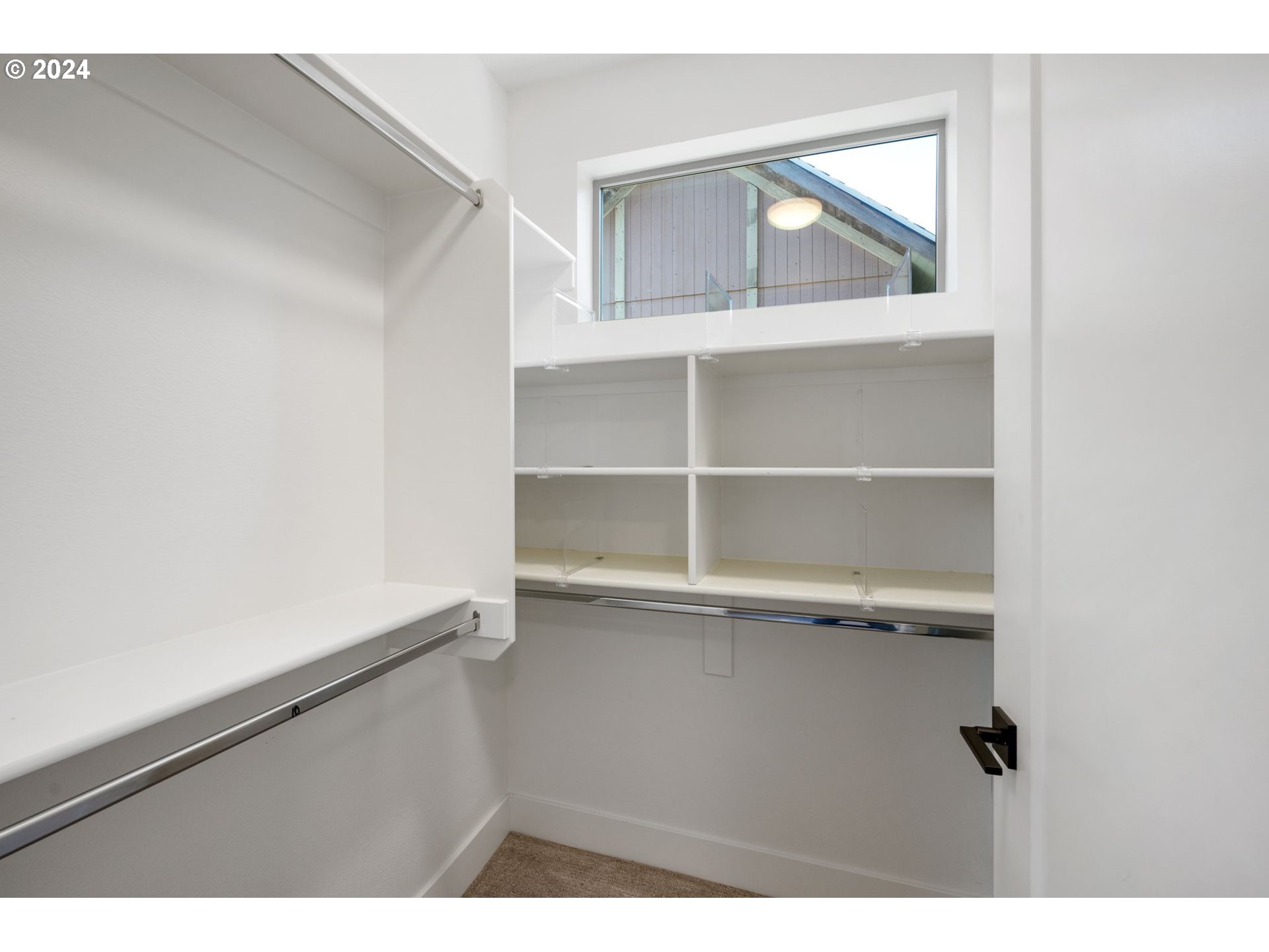 1616 Northeast 45th Avenue, Unit 1 Portland, OR 97213 - Photo 21 of 30 a view of a room with rack on the wall
