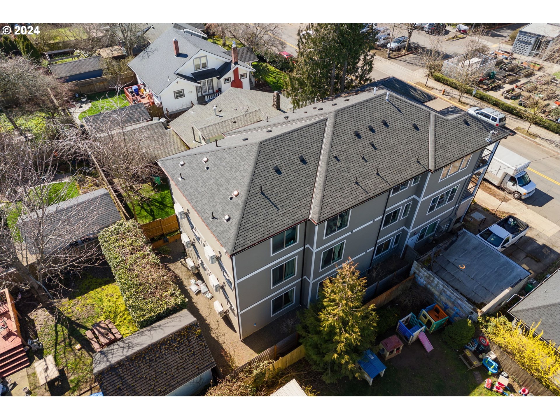 1616 Northeast 45th Avenue, Unit 1 Portland, OR 97213 - Photo 25 of 30 an aerial view of multiple houses with a yard
