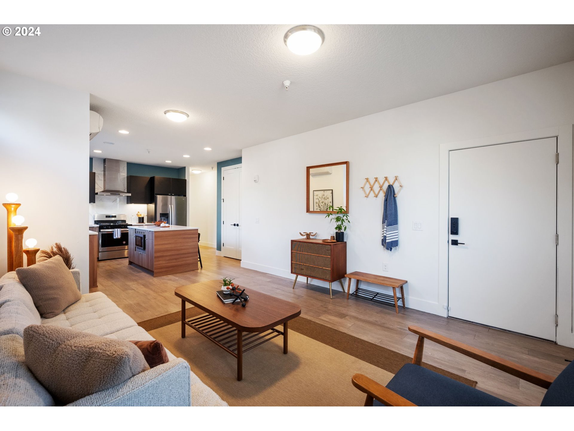 1616 Northeast 45th Avenue, Unit 1 Portland, OR 97213 - Photo 3 of 30 a living room with furniture and a table